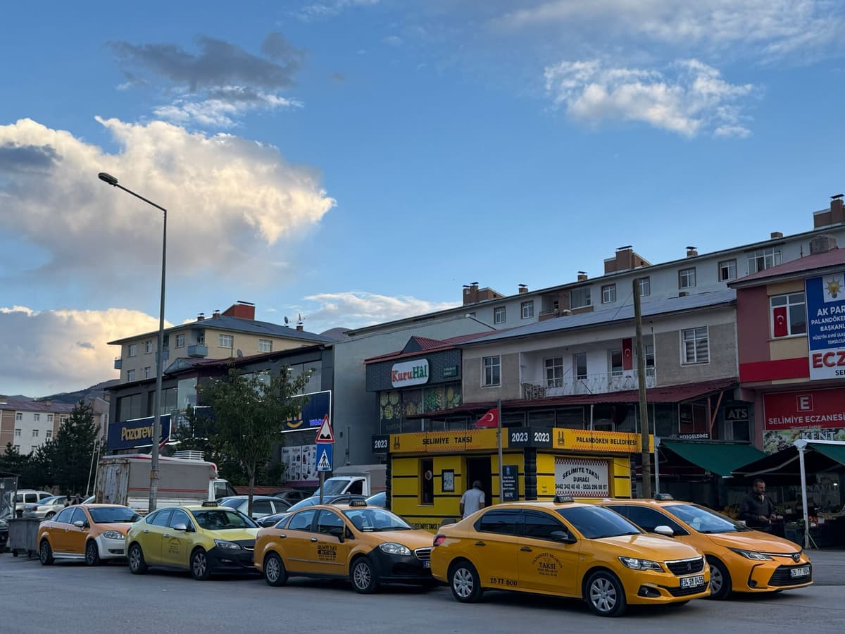 Front view of a modern yellow taxi.