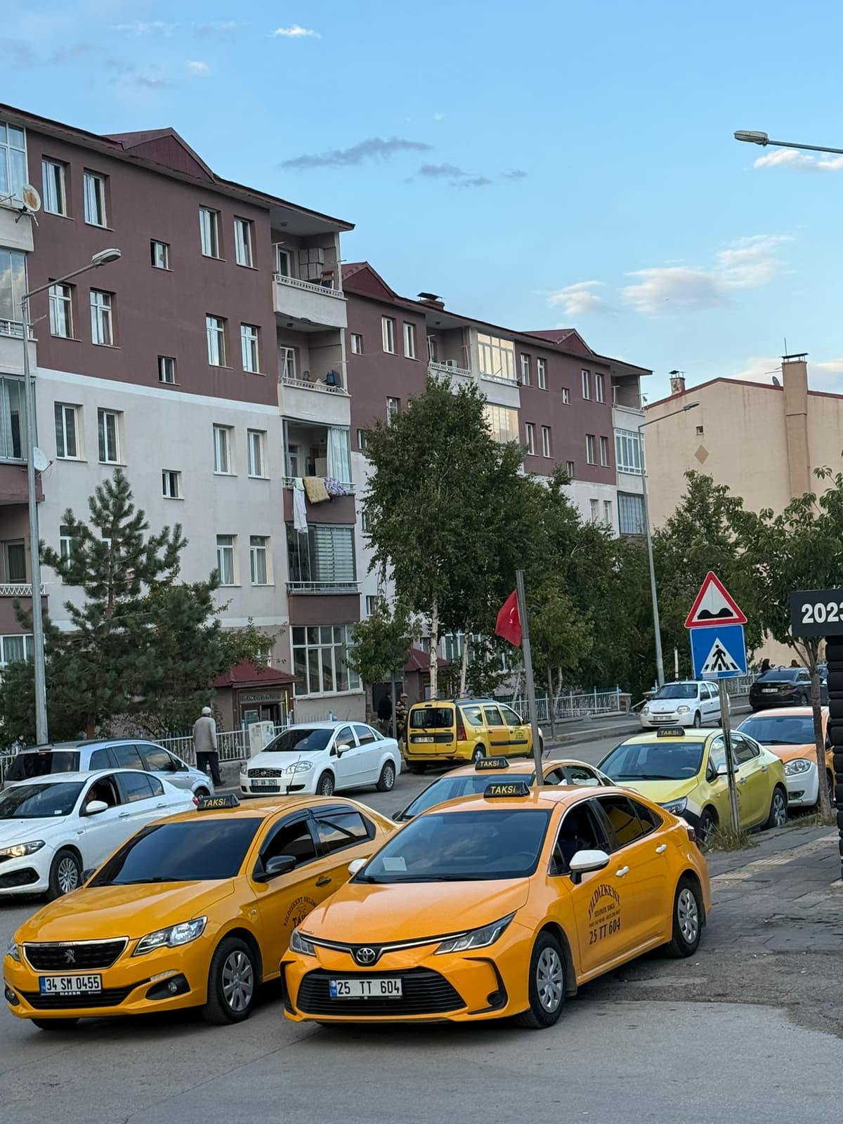 Another model of a yellow taxi from the fleet.